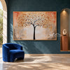 Golden Leaf Tree on a Peach Background Wall Art shown above a blue chair and a blue-fronted console.