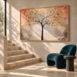 Golden Leaf Tree on a Peach Background Wall Art shown beside a staircase.