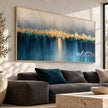 Golden Skyline over Blue Water shown above a sofa.