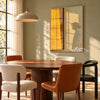 Golden Window Light and Bowed Figure Wall Art shown above a dining table.