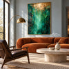 Green and Gold Color Abstract Wall Art shown above an orange sofa.