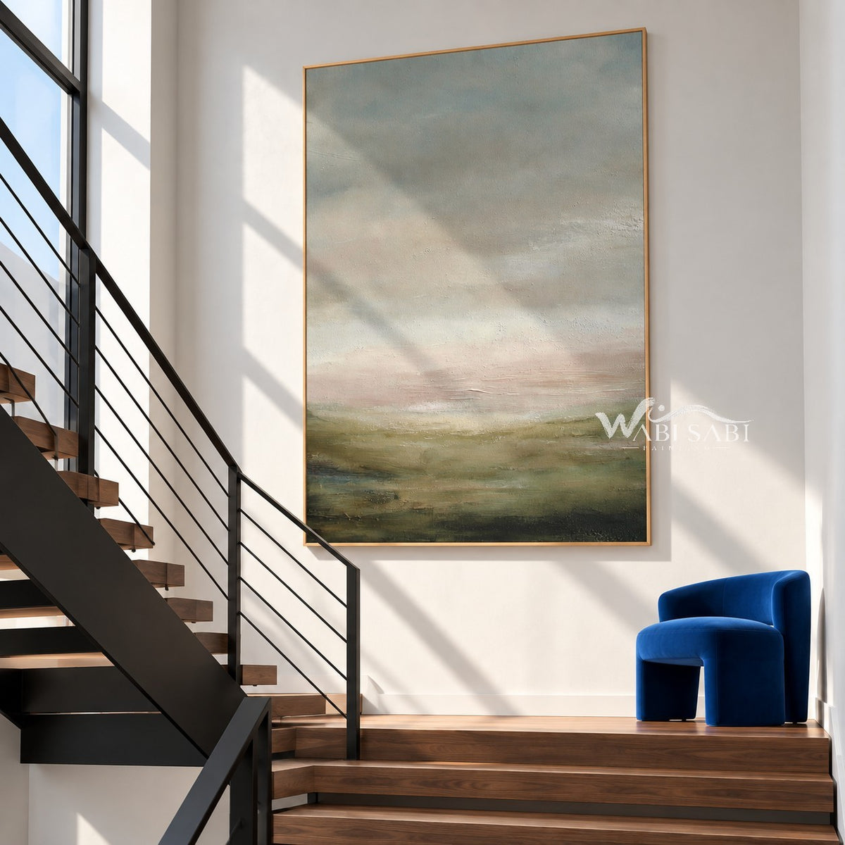 Hazy Sage Hills Landscape Painting shown beside a staircase.