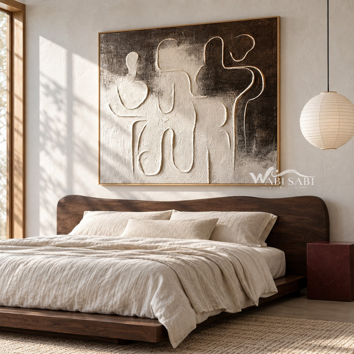 Interlocking Black and White Figures Painting shown in a bedroom.
