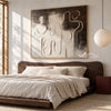 Interlocking Black and White Figures Painting shown in a bedroom.
