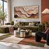Ivory and Brown Rolling Layer Wall Art shown above a green sectional sofa.