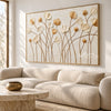 Ivory and Gold Wildflower Stems shown above a sofa.
