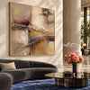 Ivory and Taupe Crossing Strokes Painting shown in a living room with a sofa.