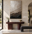 Ivory and Taupe Layered Ridge Painting shown above a console.