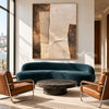 Ivory Stepped Shapes and Grooves Painting shown in a living room with a sofa.