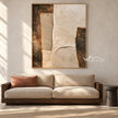 Ivory Stepped Shapes and Grooves Painting shown in a living room with a sofa.