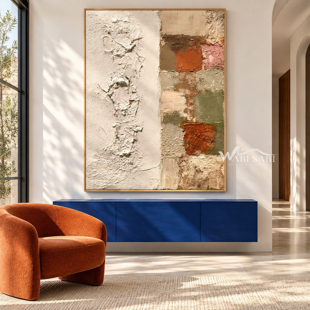 Ivory Texture and Earth Tone Blocks Wall Art shown above a blue console beside an orange chair.