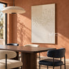 Ivory Texture Sweep and Dotted Grid Wall Art shown above a dining table on a terracotta wall.