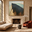 Lone Figure on a Broad Mountain Ridge Wall Art shown above a fireplace.