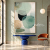 Mint Green Rounded Forms Abstract Painting shown in an entryway.