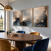 Misty Blue and Charcoal Landscape Triptych shown behind a dining table.