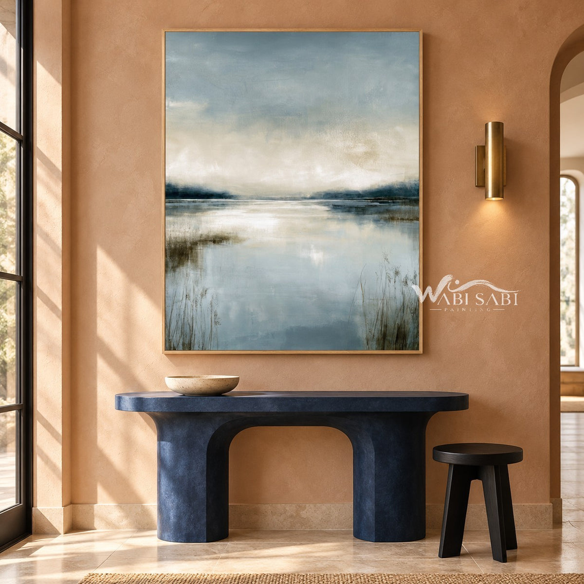 Misty Blue Lake with Reeds Wall Art shown above a blue console.