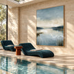 Misty Blue Lake with Reeds Wall Art shown beside an indoor pool.
