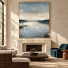 Misty Blue Lake with Reeds Wall Art shown above a fireplace.