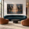 Misty Skyline with Amber Reflections Painting shown in a living room with a sofa.