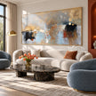 Muted Blue and Ochre Geometric Wall Art shown in a living room with a sofa.