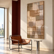 Narrow Stacked Neutral Blocks Wall Art shown in a reading area.