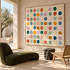 Pastel and Bright Dot Grid Painting shown in a seating area.