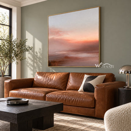 Peach Sunset over Quiet Water Wall Art shown above a brown leather sofa.
