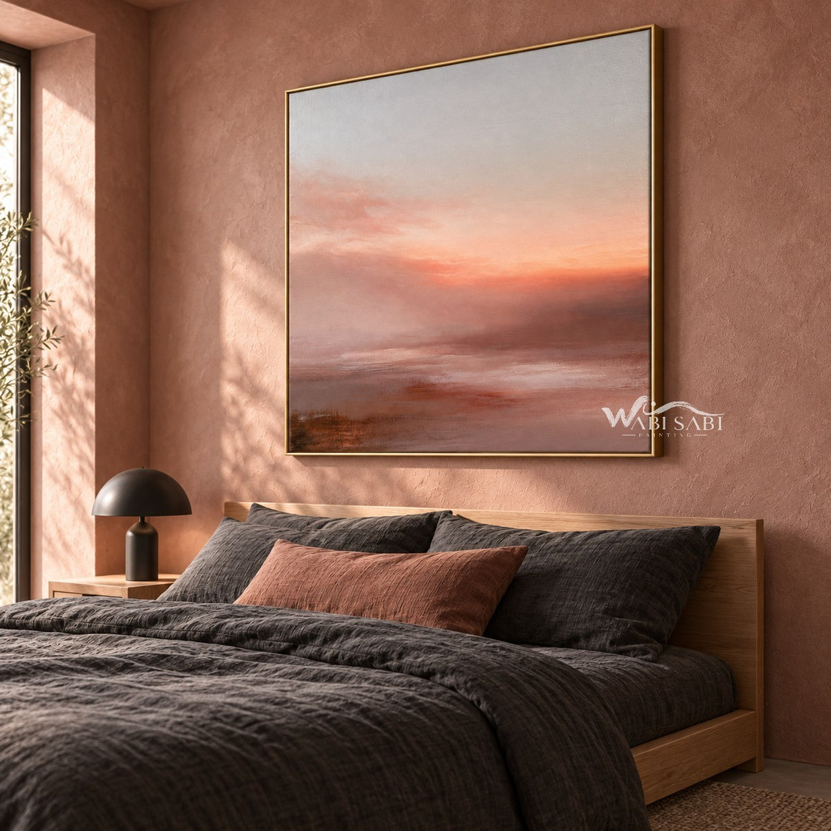 Peach Sunset over Quiet Water Wall Art shown above a bed with dark bedding.