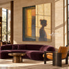 Quiet Figure beside an Amber Window Wall Art shown above a curved burgundy sofa.