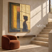 Quiet Figure beside an Amber Window Wall Art shown above a bench beside a staircase.