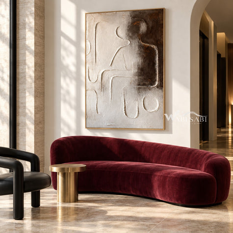 Raised Line Seated Figure Abstract Painting shown in a living room with a sofa.