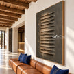 Raised Steps on Charcoal Canvas shown above a sofa.