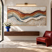 Rust and Blue Gray Strata Panorama Painting shown above a console.