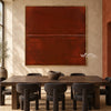 Rust Red Field with a Fine Seam Wall Art shown behind a dining table.