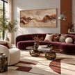 Rust Seam and Cream Contour Wall Art shown above a burgundy sofa.
