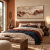 Rust Seam and Cream Contour Wall Art shown above a bed with blue bedding.