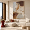 Sandstone Curves Abstract Canvas shown above a sofa.