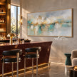 Soft Aqua Horizon with Gold Accents Wall Art shown above a bar counter.