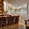 Soft Aqua Horizon with Gold Accents Wall Art shown above a bar counter.