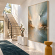 Soft Cream and Sage Cloud Abstract Painting shown beside a staircase.