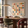 Square Muted Color Circle Grid Wall Art shown above a dining table.