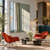Sunlit Green Wall and Sheer Curtain Painting shown in a seating area.
