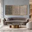 Taupe Texture Study Triptych Wall Art shown above a curved pale sofa.