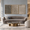 Taupe Texture Study Triptych Wall Art shown above a curved pale sofa.