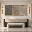 Taupe Texture Study Triptych Wall Art shown above a fireplace and pale bench.
