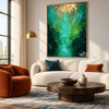 Teal Abstract Wall Art with Gold Color Accents shown above a cream sofa.