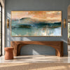 Teal Mountain Lake beneath a Peach Sky shown above a wood console.