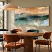 Teal Mountain Lake beneath a Peach Sky shown above a dining table.