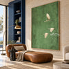 Three White Birds on Muted Green Wall Art shown above a low brown lounge seat.