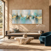 Turquoise Reflections and Gold Horizon Wall Art shown above a pale sofa.